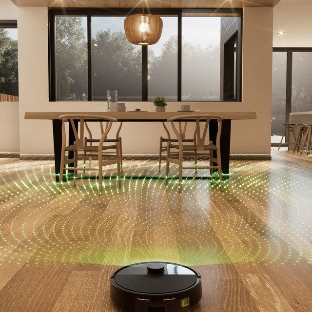 iRobot Roomba robotporszívó működés közben egy nappaliban
